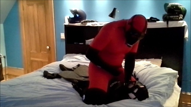 Red and Black Zentai Shoots on Defeated Frogman